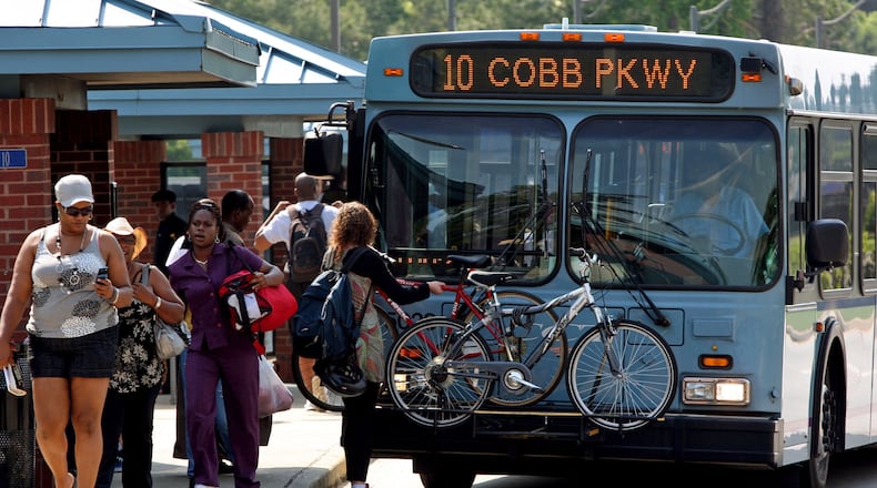 Pedestrians get off of a Cobb County Transit (CCT) bus at the Cumberland Blvd Tranfer Center across the street from the Cumberland Mall in Cobb County Thursday afternoon in Atlanta, Ga., May 12, 2011. Photo by Jason Getz / AJC Pedestrians get off of a Cobb County Transit (CCT) bus at the Cumberland Blvd Tranfer Center across the street from the Cumberland Mall in Cobb County Thursday afternoon in Atlanta, Ga., May 12, 2011. Photo by Jason Getz / AJC