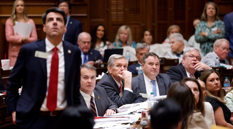 Representatives watch the voting board following a vote on a property tax bill at the House of Representatives on Sine Die, the last day of the legislature, at the Capitol in Atlanta on April 2, 2026. (Arvin Temkar/AJC)