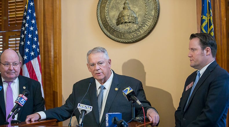 Georgia Speaker of the House David Ralston, center, stands with state Rep. Scott Holcomb, right, and Vernon Keenan, then the director of the Georgia Bureau of Investigation, during a press conference about the processing of rape kits and subsequent additional budget funding. (ALYSSA POINTER/ALYSSA.POINTER@AJC.COM)