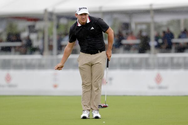 Alejandro Tosti gestures as he checks his line on the 18th green during the first round of the Houston Open golf tournament, Thursday, March 27, 2025, in Houston. (AP Photo/Michael Wyke)