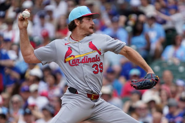 St. Louis Cardinals pitcher Miles Mikolas throws the ball against the Chicago Cubs during the first inning of a baseball game Friday, July 4, 2025, in Chicago. (AP Photo/David Banks)