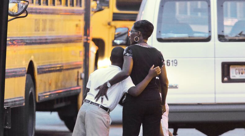 DeKalb County: Teachers and students reunited with hugs in 2013 after a gunman slipped into the building and terrorized the DeKalb County school. No one was injured in the incident, but the 20-year-old suspect, Michael Brandon Hill, shot at police. He was eventually taken into custody without incident. JOHN SPINK/JSPINK@AJC.COM