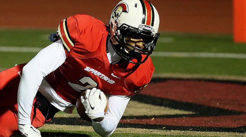 November 28, 2014-NORCROSS: Greater Atlanta Christian's # 2 Darius Slayton dives into the end zone for an early touchdown against the Vidalia Indians during the first half of their round three high school football playoff game at Spartan Stadium in Norcross on Friday November 28th, 2014. (Photo by Phil Skinner)