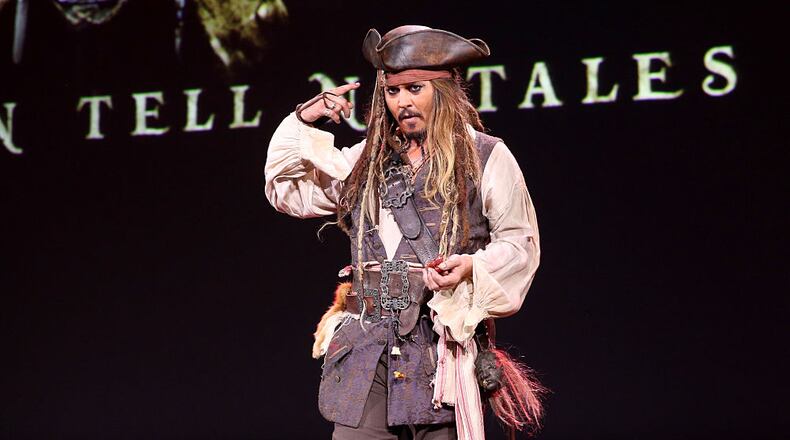 ANAHEIM, CA - AUGUST 15: Actor Johnny Depp, dressed as Captain Jack Sparrow, of PIRATES OF THE CARIBBEAN: DEAD MEN TELL NO TALES took part today in "Worlds, Galaxies, and Universes: Live Action at The Walt Disney Studios" presentation at Disney's D23 EXPO 2015 in Anaheim, Calif. (Photo by Jesse Grant/Getty Images for Disney)