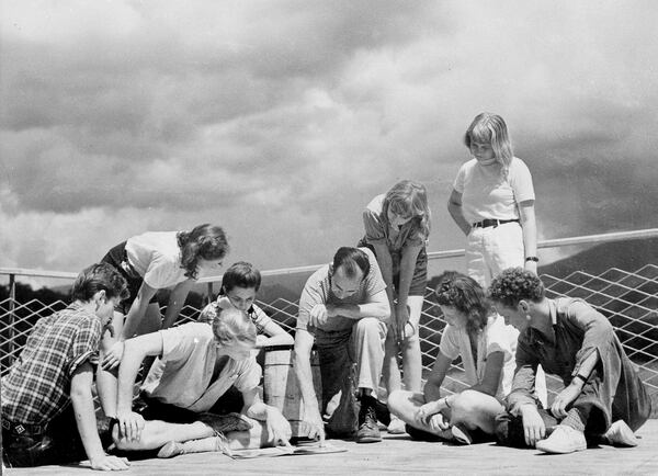 Black Mountain College fostered non-traditional learning in the visual and performing arts during the 1960s and '70s. Here, architect-teacher of Black Mountain College Lawrence Kocher, center, and a group of students hold a discussion session on the sun deck of the studies building in Black Mountain, N.C., Feb. 20, 1944. (AP Photo)