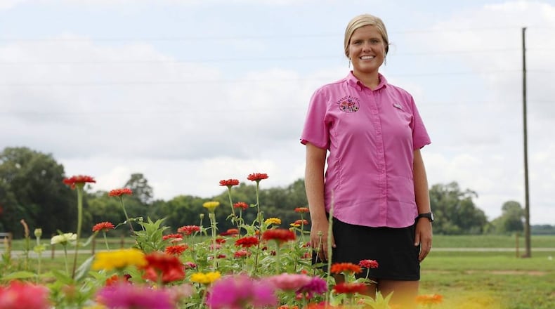 Arena Acres founder Samantha Lineberger poses in rows of flowers on Arena Acres flower farm on Thursday, July 25, 2024, in Perry, Georgia. The land that Arena Acres is now on has been in Linebarger’s family for over seventy years. (Photo Courtesy of Katie Tucker/The Telegraph)