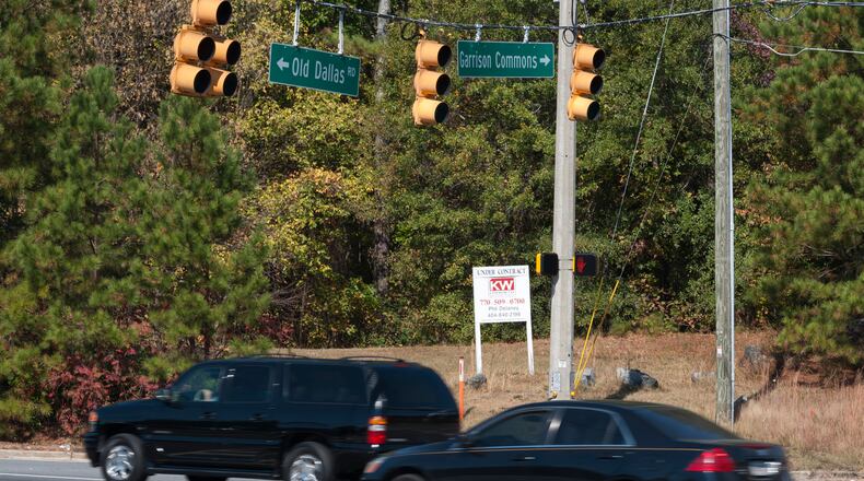 A twenty four acre parcel of land at the intersection of Dallas Highway and Garrison Commons Drive in West Cobb is the subject of a lawsuit against the county (DAVID BARNES / DAVID.BARNES@AJC.COM)