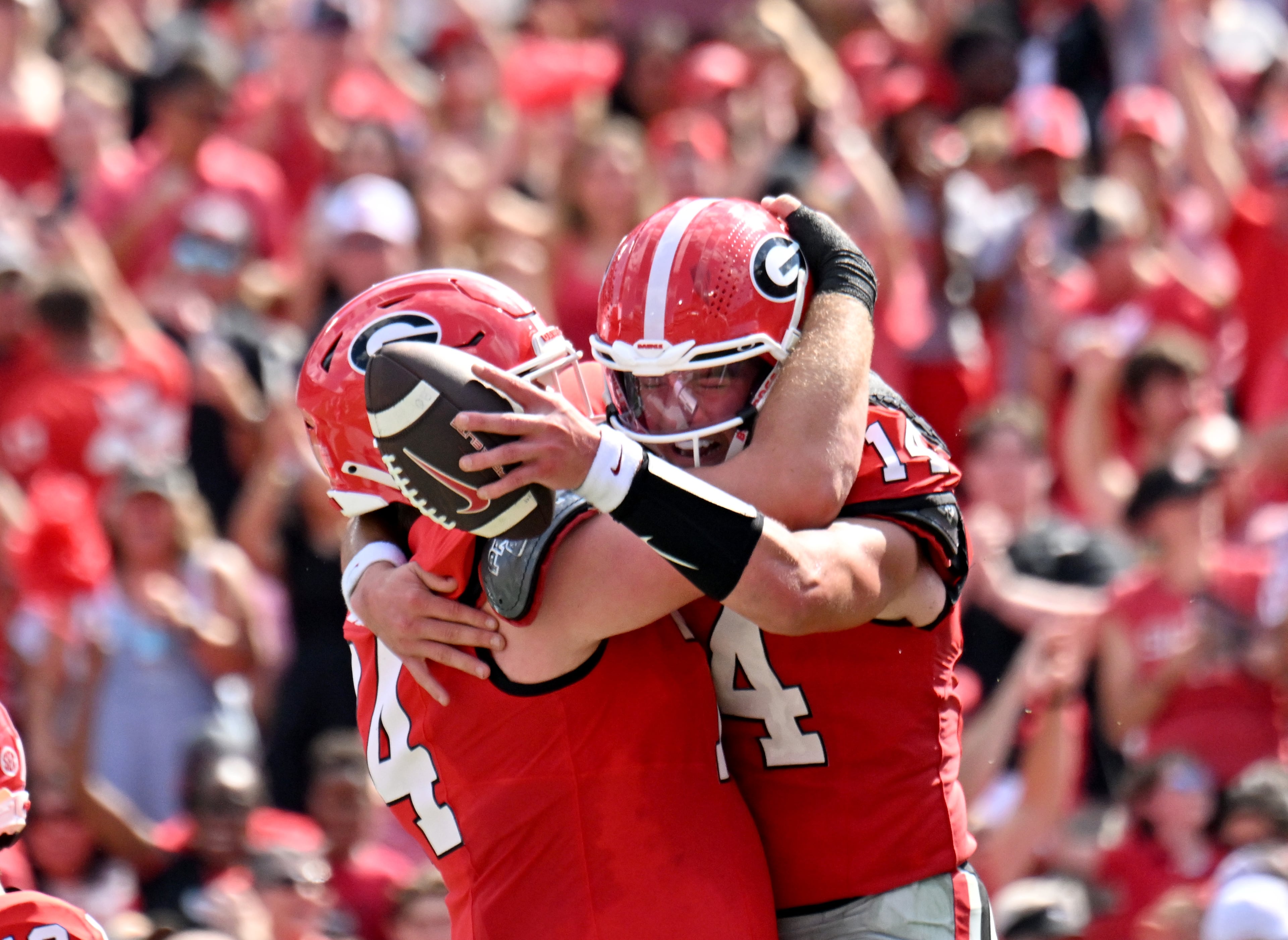 Georgia quarterback Gunner Stockton (14) celebrates with teammates after scoring a touchdown during the first half in an NCAA football game at Sanford Stadium, Saturday, August 30, 2025, in Athens. (Hyosub Shin / AJC)