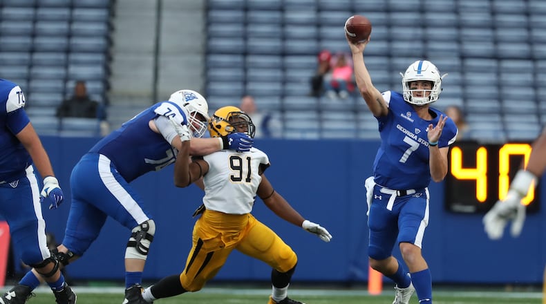 November 25, 2017 - Atlanta, Ga: Georgia State Panthers quarterback Conner Manning (7) attempts a pass as offensive tackle Sebastian Willer (74) blocks Appalachian State Mountaineers defensive lineman Tommy Dawkins (91) in the second half of their game at GSU Stadium Saturday, November 25, 2017, in Atlanta. Appalachian State Mountaineers won 31-10. PHOTO / JASON GETZ