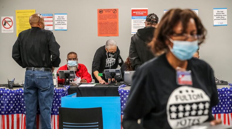 Several dozen voters showed up in the first hour of early voting at the Buckhead Library in Atlanta on Monday, Oct. 17, 2022. (John Spink/The Atlanta Journal-Constitution/TNS)