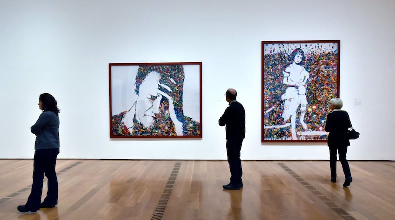 Visitors take in the Vik Muniz retrospective at The High Museum of Art in February 2016. HYOSUB SHIN / HSHIN@AJC.COM