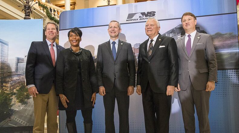 Fortune 500 company Norfolk Southern officially announced at a press conference December 12 that they will be moving their headquarters to Atlanta. They will be building in Atlanta’s Midtown community. Georgia Governor-Elect Brian Kemp (from left), Atlanta Mayor Keisha Lance Bottoms, Norfolk Southern CEO Jim Squires, Georgia Governor Nathan Deal and Commissioner of the Georgia Department of Economic Development Pat Wilson (right) stand for a photo following the press conference in the Georgia State Capitol building in Atlanta. (ALYSSA POINTER/ALYSSA.POINTER@AJC.COM)