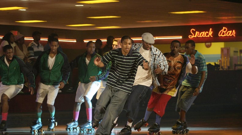 Double Duty: Actors Pierpont Greer (from left), Kenya Tyson, Hakeem Agele and James Jones double for the principals during a scene with the “Preps” (background) during filming of a Warner Bros. movie produced by music impresario Dallas Austin and directed by Chris Robinson shot at Cascade Family Skating Rink in Cascade. SEAN DRAKES/Special