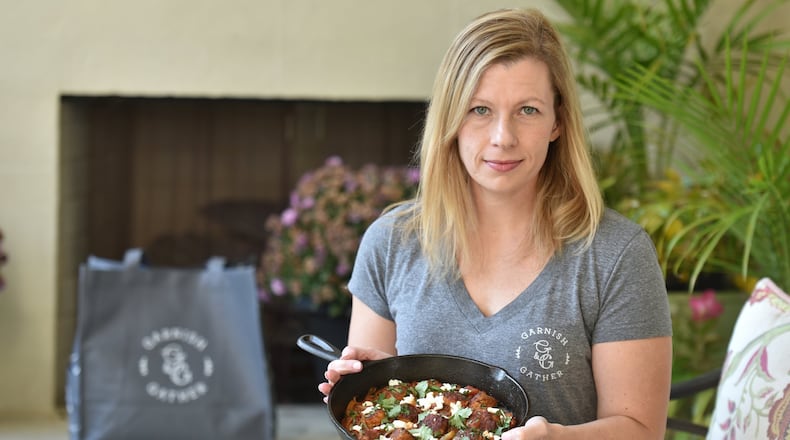 Emily Golub is the founder of Garnish & Gather, a metro Atlanta-based meal kit and grocery company. The company has filed a trademark infringement lawsuit against Target, which recently launched one of its biggest endeavors ever, a new grocery and meals brand called Good & Gather. Golub said Target’s new brand uses logos similar to those of her company’s, including a round logo circled by its name with leaf motifs. (Hyosub Shin / Hyosub.Shin@ajc.com)