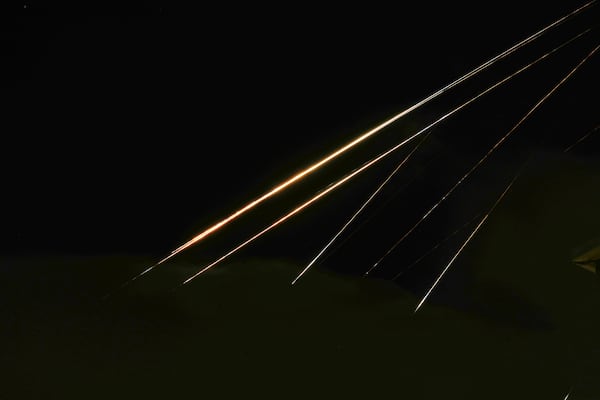 Traces of projectile illuminates the sky seen from northern Israel, Saturday, June 14, 2025. (AP Photo/Ariel Schalit)