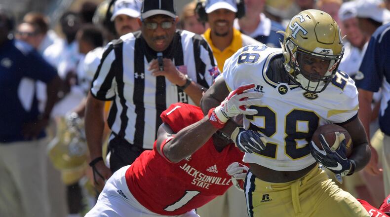 Georgia Tech running back J.J. Green (28) runs down the sidelines until he is pushed out by Jacksonville State safety Marlon Bridges (1) in the first half of Jackets’ home opener at Bobby Dodd Stadium Saturday, Sept. 9, 2017, in Atlanta.