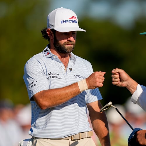 Cameron Young celebrates after a putt on the 18th hole during the third round of the Masters golf tournament at the Augusta National Golf Club, Saturday, April 11, 2026, in Augusta, Ga. (AP Photo/Matt Slocum)