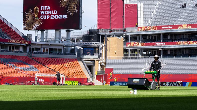 A worker mows the grass at Toronto Stadium, Thursday June 4, 2026, in Toronto, in preparation for World Cup soccer tournament. (Frank Gunn/The Canadian Press via AP)