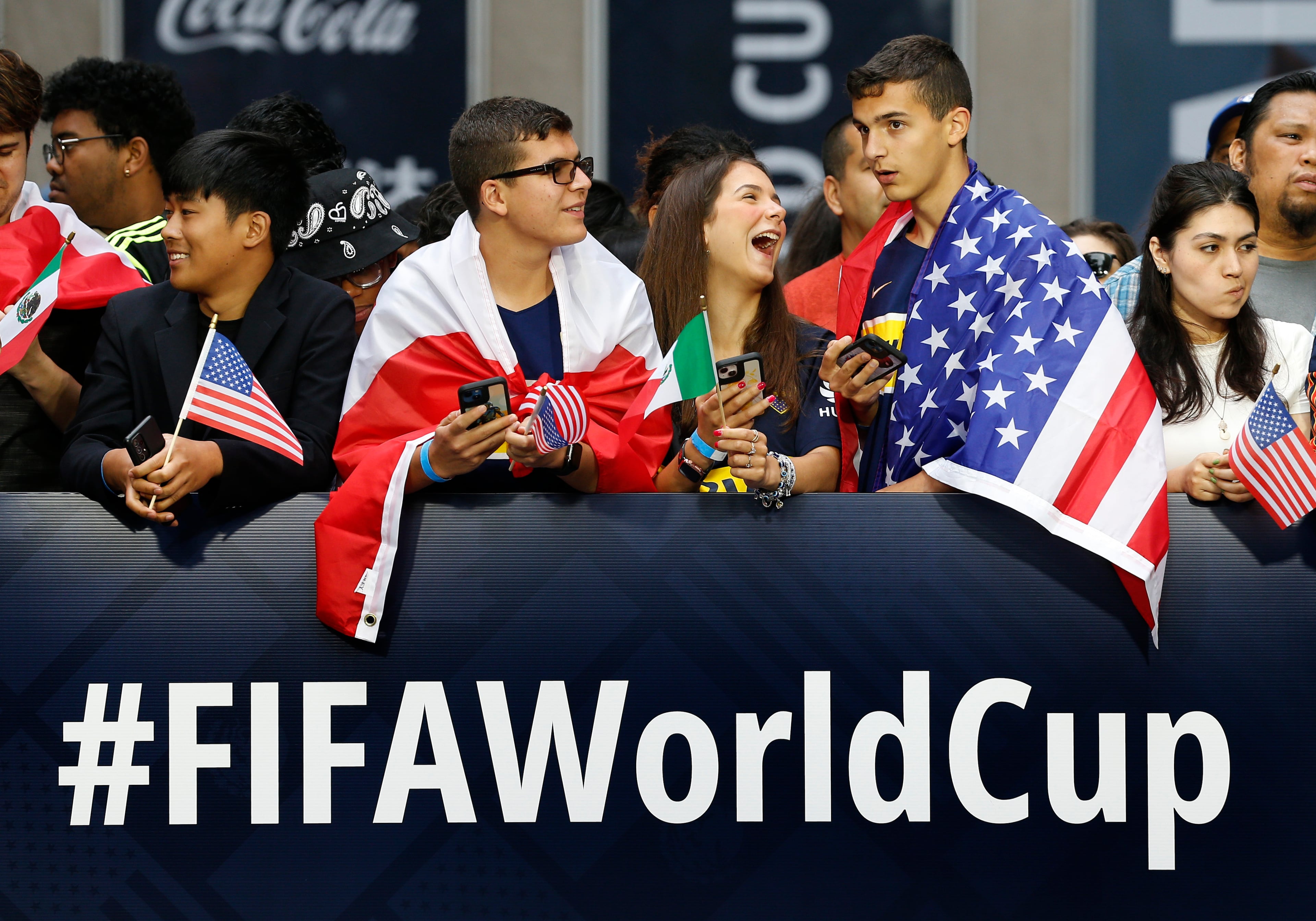 Fans wait along 6th Avenue in New York in 2022 for FIFA's announcement of the names of the host cities for the 2026 World Cup soccer tournament. Atlanta was chosen as a host city, and on Wednesday four Atlanta-based companies were named as sponsors for the matches in the city: Cox Enterprises, Georgia-Pacific, Home Depot and Southern Co. (Noah K. Murray/AP 2022)