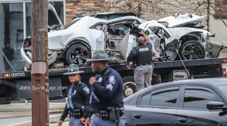 Atlanta fire crews investigated a wreck at the intersection of Northside Drive and Whitehall Street. Officials say the crash took out two power poles and traffic lights.