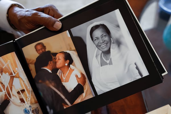 Betty Madison shares photos of herself and her husband Glenn from their 50th wedding anniversary ceremony on Thursday, Feb. 12, 2026. The couple met in 1957 and have been married for 65 years. (Natrice Miller/AJC)