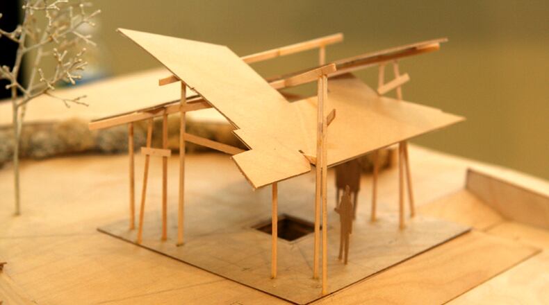 An architect’s model depicts the multi-roofed structure that would mark the site of the natural spring that gave Sandy Springs its name.