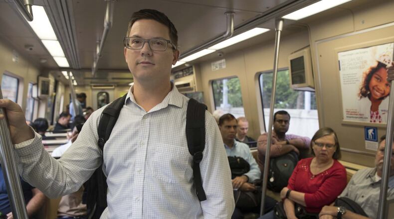 Ryan Esslinger (left) of Dunwoody, would love to take MARTA more often. But he finds himself using it less instead. Transit ridership is declining in Atlanta and across the country. ALYSSA POINTER/ATLANTA JOURNAL-CONSTITUTION