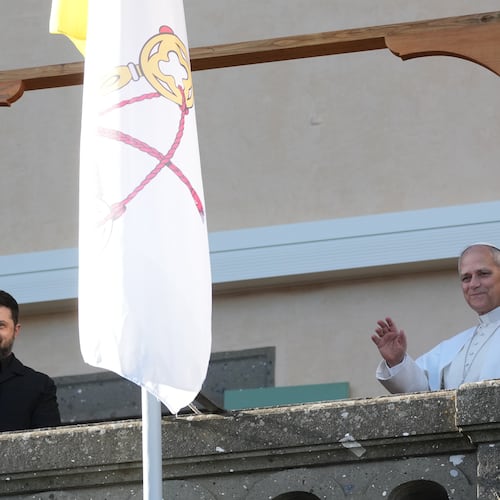 Ukraine's President Volodymyr Zelenskyy and Pope Leo XIV wave to journalists during their meeting in Castel Gandolfo, Italy, Tuesday, Dec. 9, 2025. (AP Photo/Andrew Medichini)