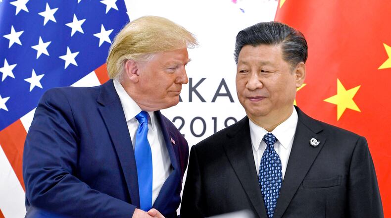FILE - President Donald Trump, left, shakes hands with China's President Xi Jinping during a meeting on the sidelines of the G-20 summit in Osaka, Japan, June 29, 2019. (AP Photo/Susan Walsh, File)