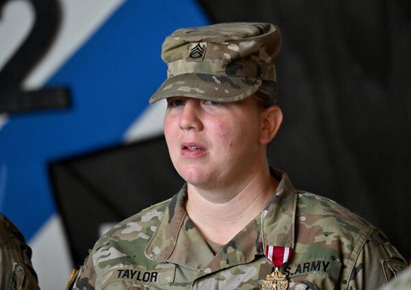 Staff Sgt. Melissa Taylor of Winter Haven, Florida, is one of six soldiers who received the Meritorious Service Medal at Fort Stewart Thursday, August 6, 2025. “I had no medical supplies or anything with me…. I had my bare hands,” Taylor, 39, said about caring for a wounded soldier. “I was covered in blood up to my elbows on both arms. There was no time for you to stop and put on gloves in a situation like that.” (Hyosub Shin / AJC)
