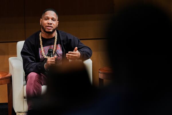 Dayvon Love, director of public policy for Leaders of a Beautiful Struggle, speaks during a panel discussion, Thursday, April 10, 2025, in Baltimore. (AP Photo/Stephanie Scarbrough)