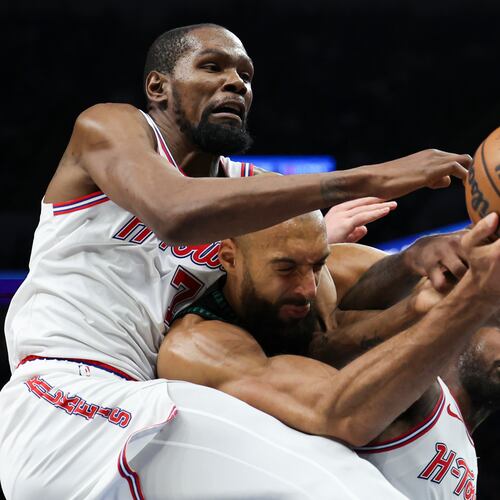 Houston Rockets forward Kevin Durant (7), Minnesota Timberwolves center Rudy Gobert, center, and Houston Rockets guard Amen Thompson, right, compete for a rebound during the first half of an NBA basketball game, Wednesday, March 25, 2026, in Minneapolis. (AP Photo/Ellen Schmidt)