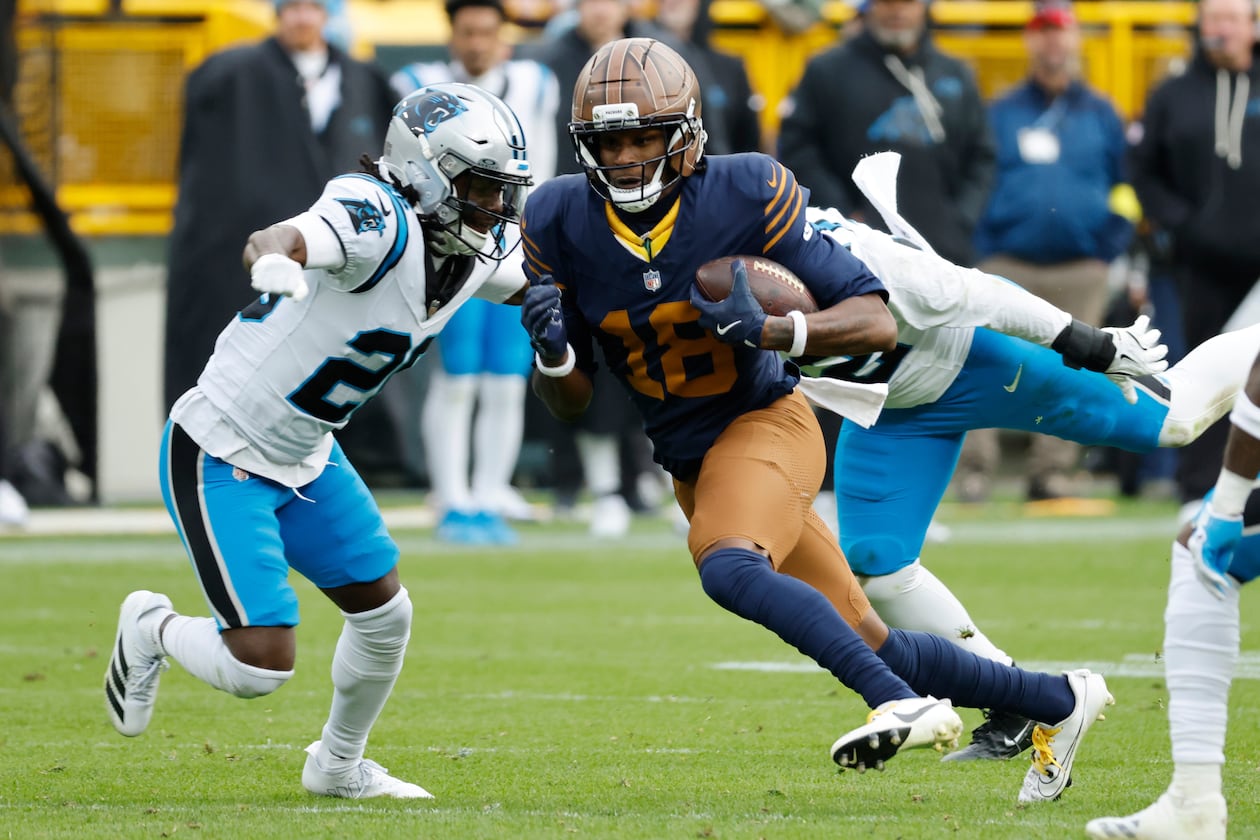 Green Bay Packers wide receiver Malik Heath (center) runs against Carolina Panthers cornerback Chau Smith-Wade (left) during the second half of an NFL football game Sunday, Nov. 2, 2025, in Green Bay, Wis. (Mike Roemer/AP)
