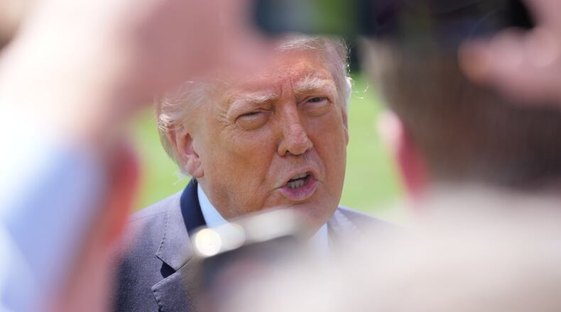 President Donald Trump speaks with reporters before departing on Marine One from the South Lawn of the White House, Friday, May 1, 2026, in Washington. (AP Photo/Alex Brandon)
