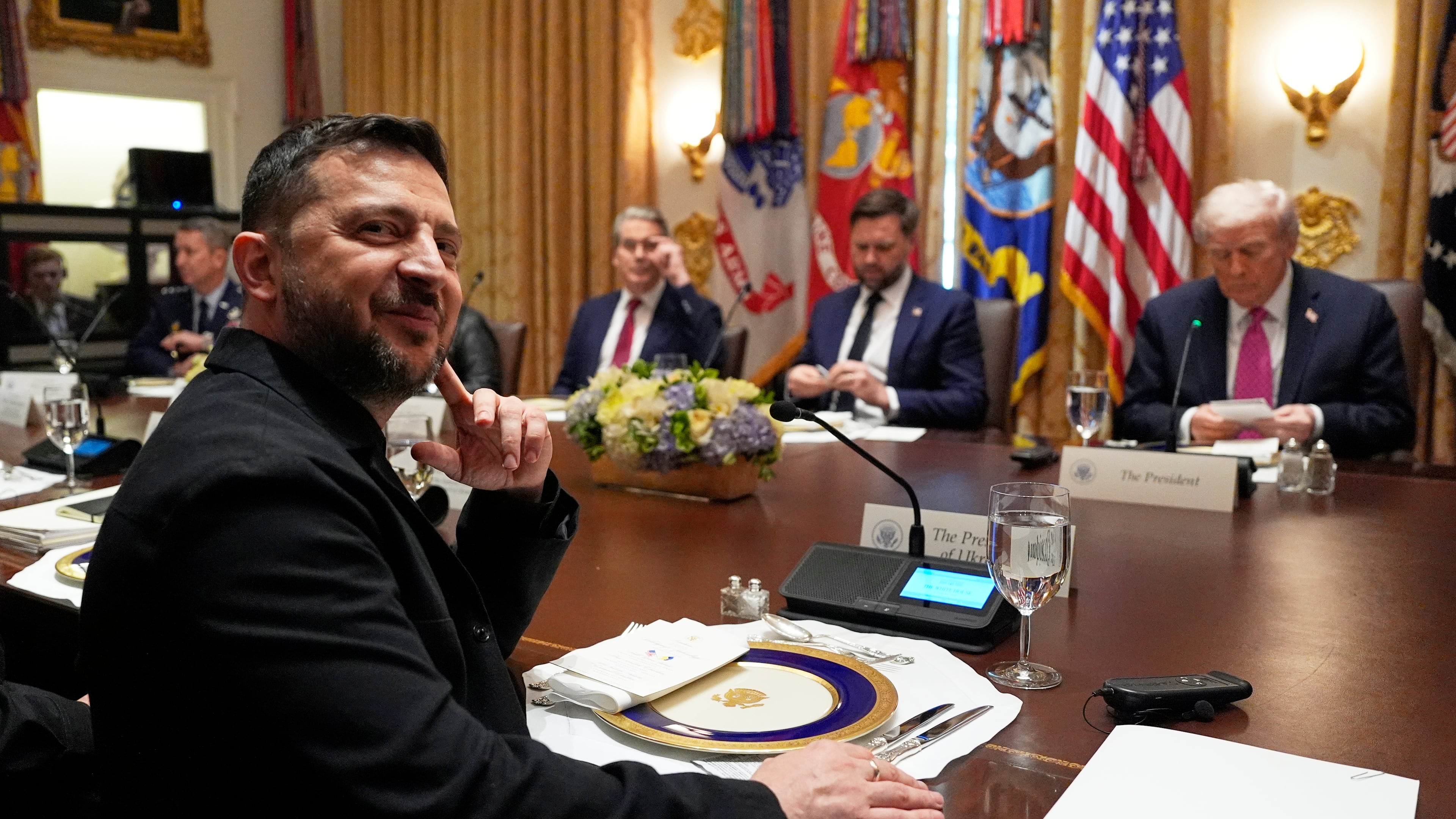 Ukraine's President Volodymyr Zelenskyy, left, sits before a meeting with President Donald Trump, from right, Vice President JD Vance and Treasury Secretary Scott Bessent in the Cabinet Room of the White House, Friday, Oct. 17, 2025, in Washington. (AP Photo/Alex Brandon)