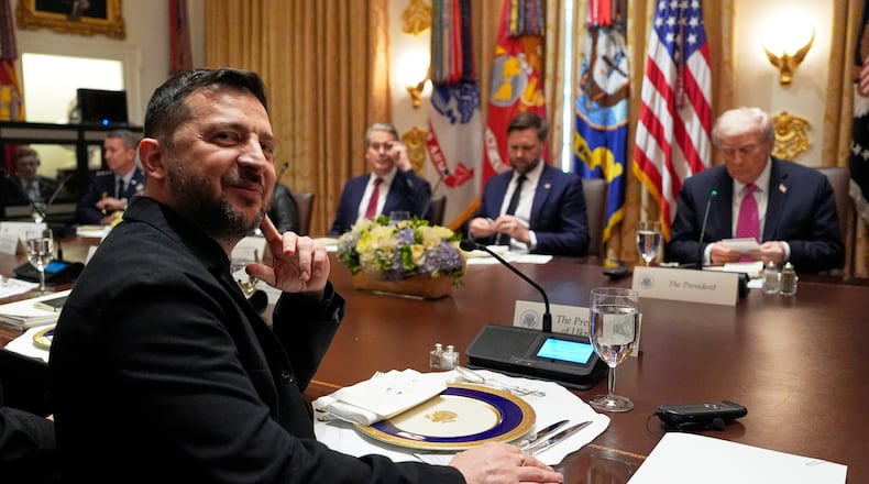 Ukraine's President Volodymyr Zelenskyy, left, sits before a meeting with President Donald Trump, from right, Vice President JD Vance and Treasury Secretary Scott Bessent in the Cabinet Room of the White House, Friday, Oct. 17, 2025, in Washington. (AP Photo/Alex Brandon)