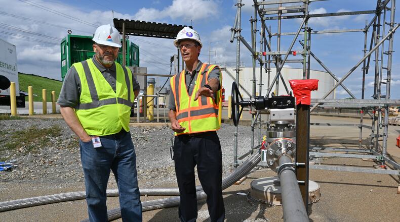 June 8, 2022 Smyrna - Dr. Mark Berry (left), vice president of Environmental and Natural Resources, and Scott Cloyd, Chief Engineer at Mitsubishi Power Americas, talk at Georgia Power’s Plant McDonough-Atkinson, on Wednesday, June 8, 2022. Georgia Power is conducting a test where it will burn hydrogen using existing infrastructure at plant McDonough. (Hyosub Shin / Hyosub.Shin@ajc.com)