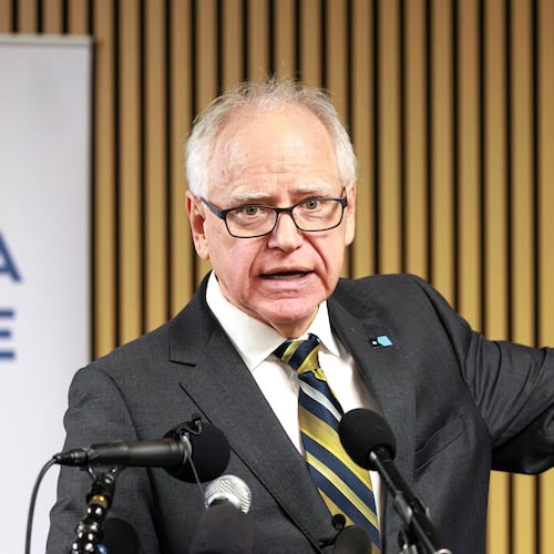 Minnesota Gov. Tim Walz responds to questions from reporters regarding whether he will seek a third term during a press conference following an event on the state's new Paid Family and Medical Leave program, Tuesday, Jan. 6, 2026, in Minneapolis. (Kerem Yücel/Minnesota Public Radio via AP)
