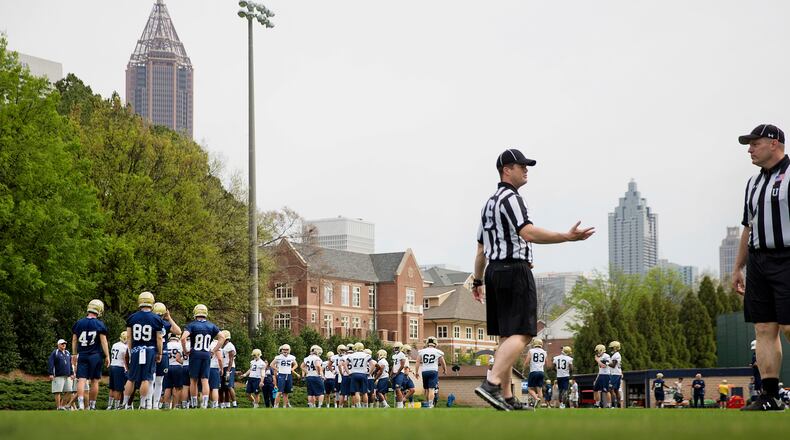Georgia Tech players take the field for an NCAA college football practice in Atlanta, Monday, March 27, 2017. Coming off a nine-win season, Georgia Tech begins spring football practice Monday with all eyes on the quarterback position after the departure of three-year starter Justin Thomas.