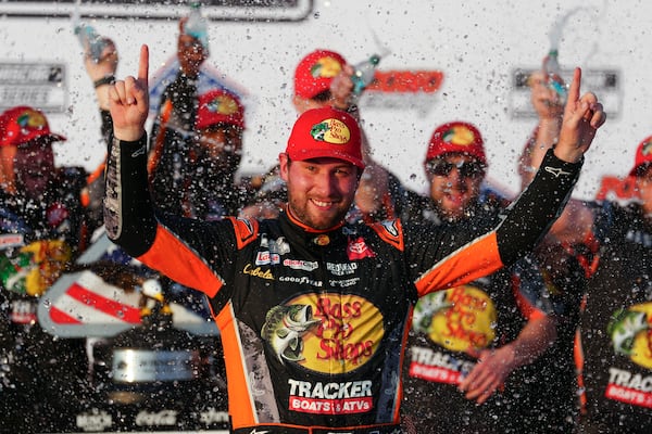 Chase Briscoe celebrates in Victory Lane after winning a NASCAR Cup Series auto race at Pocono Raceway, Sunday, June 22, 2025, in Long Pond, Pa. (AP Photo/Derik Hamilton)