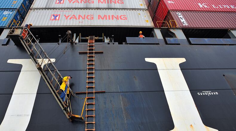 021512 Savannah, GA: River boat pilot Same Meyer climbs off a cargo ship after safely guiding it down the Savannah River Wednesday February 15, 2012. Local pilots board and deboard moving ships several times a day to guide the ships through Savannah River's narrow channel. . Brant Sanderlin bsanderlin@ajc.com