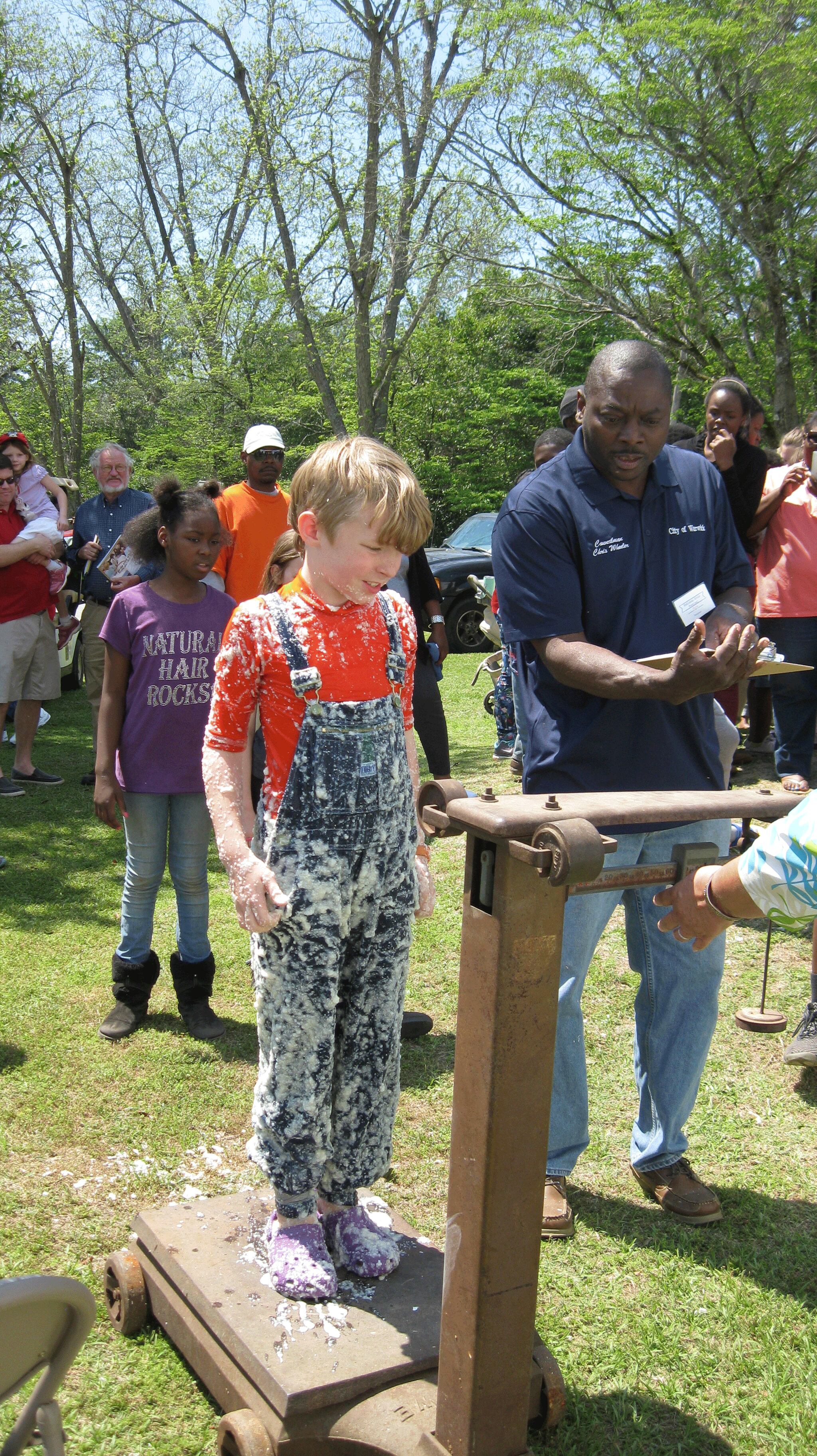 A boy gets weighed after entering the Grits Pit during the National Grits Festival in Warwick. / Courtesy of the National Grits Festival