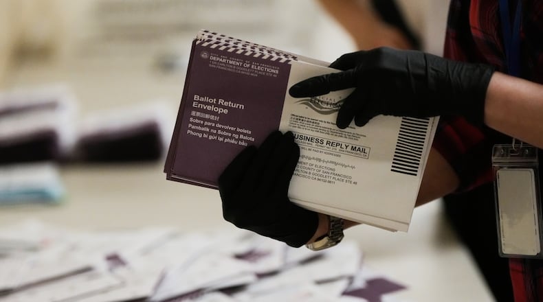 Department of Elections workers sort mail-in ballots for the California primary election at City Hall on Tuesday, June 2, 2026, in San Francisco. (AP Photo/Jeff Chiu)