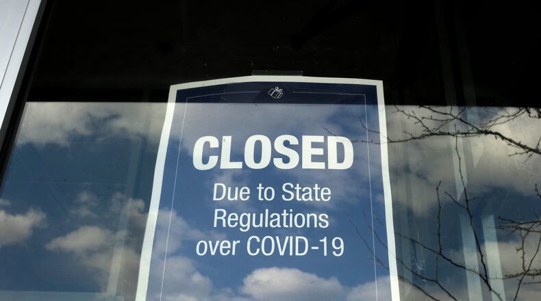 The number of Americans seeking unemployment benefits fell slightly last week to 793,000, evidence that job cuts remain high despite a substantial decline in new viral infections. (AP Photo/Steven Senne)