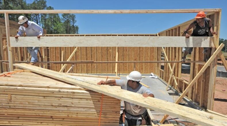 Woodstock has temporarily stopped accepting plans and applications for certain categories of rental and single-family home projects. AJC FILE