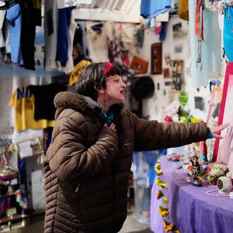 A person prays at a sanctuary dedicated to late Argentine singer Gilda on the 30th anniversary of her death in a bus crash, in Entre Rios, Argentina, Monday, Sept. 7, 2026. (AP Photo/Natacha Pisarenko)