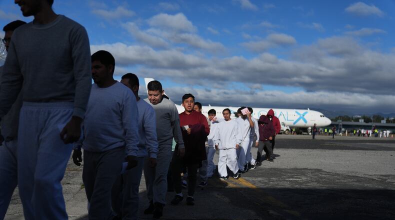 FILE - Guatemalans deported from the U.S. arrive at La Aurora airport in Guatemala City, Dec. 30, 2025, after deplaning a repatriation flight. (AP Photo/Moises Castillo, File)