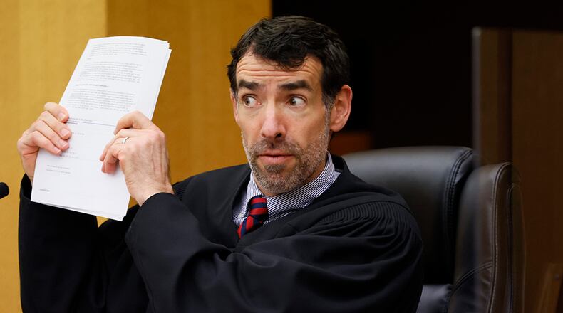 Fulton County Superior Court Judge Robert McBurney reacts to arguments by D.A. Fani Willis asking not to release the investigation report by a special grand jury into whether former President Donald Trump or his allies criminally interfered in Georgia's 2020 elections. Miguel Martinez / miguel.martinezjimenez@ajc.com