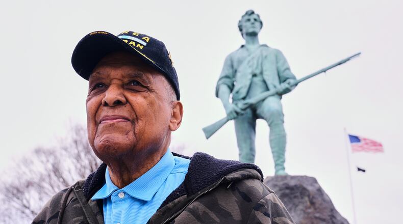 Revolutionary War re-enactor Charles Price, 95, who for decades portrayed enslaved Minuteman Prince Estabrook, poses for a portrait near the Minute Man statue, Monday, April 13, 2026, in Lexington, Mass. (AP Photo/Charles Krupa)