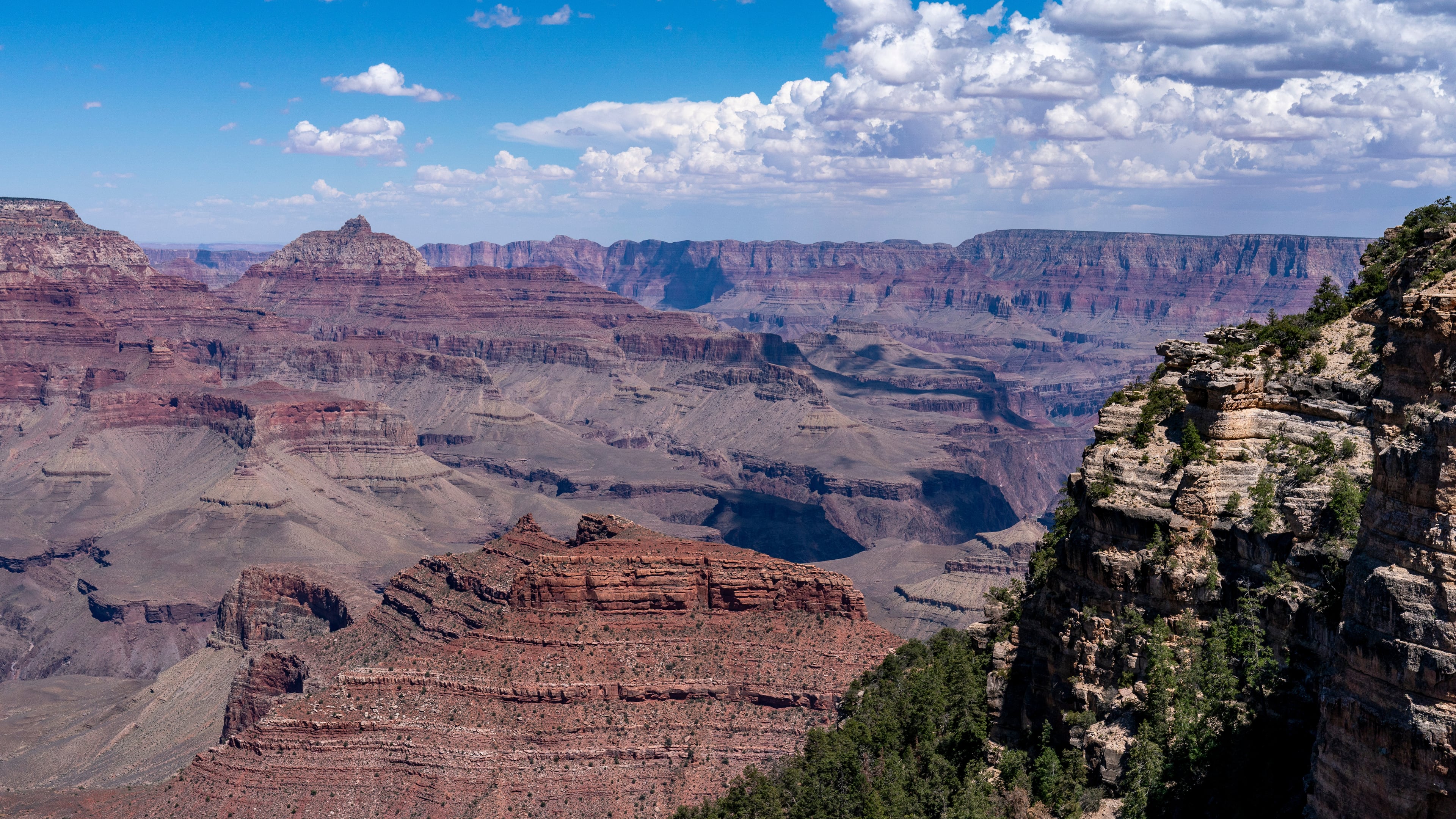 FILE - Clouds pass over the South Rim of Grand Canyon National Park in Grand Canyon Village, Ariz., Aug. 8, 2023. (AP Photo/Alex Brandon, File)
